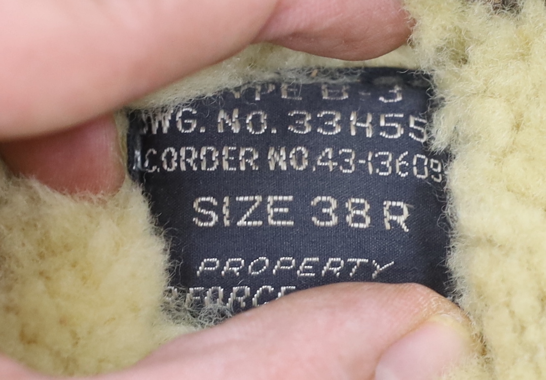 A United States Air Force Type B-3 sheepskin flying jacket, with label to collar reading; ‘Type B-3 DWG. No.33H5595 AC Order No.43-13609-AF Size 38R Property Air Force U.S. Army’
